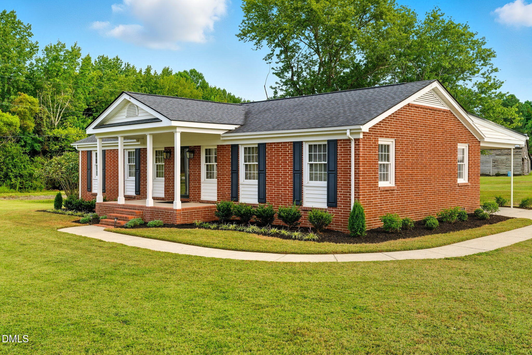 2238 Tarboro Road Youngsville, NC 27596 - Photo 2 of 41 a front view of a house with a yard