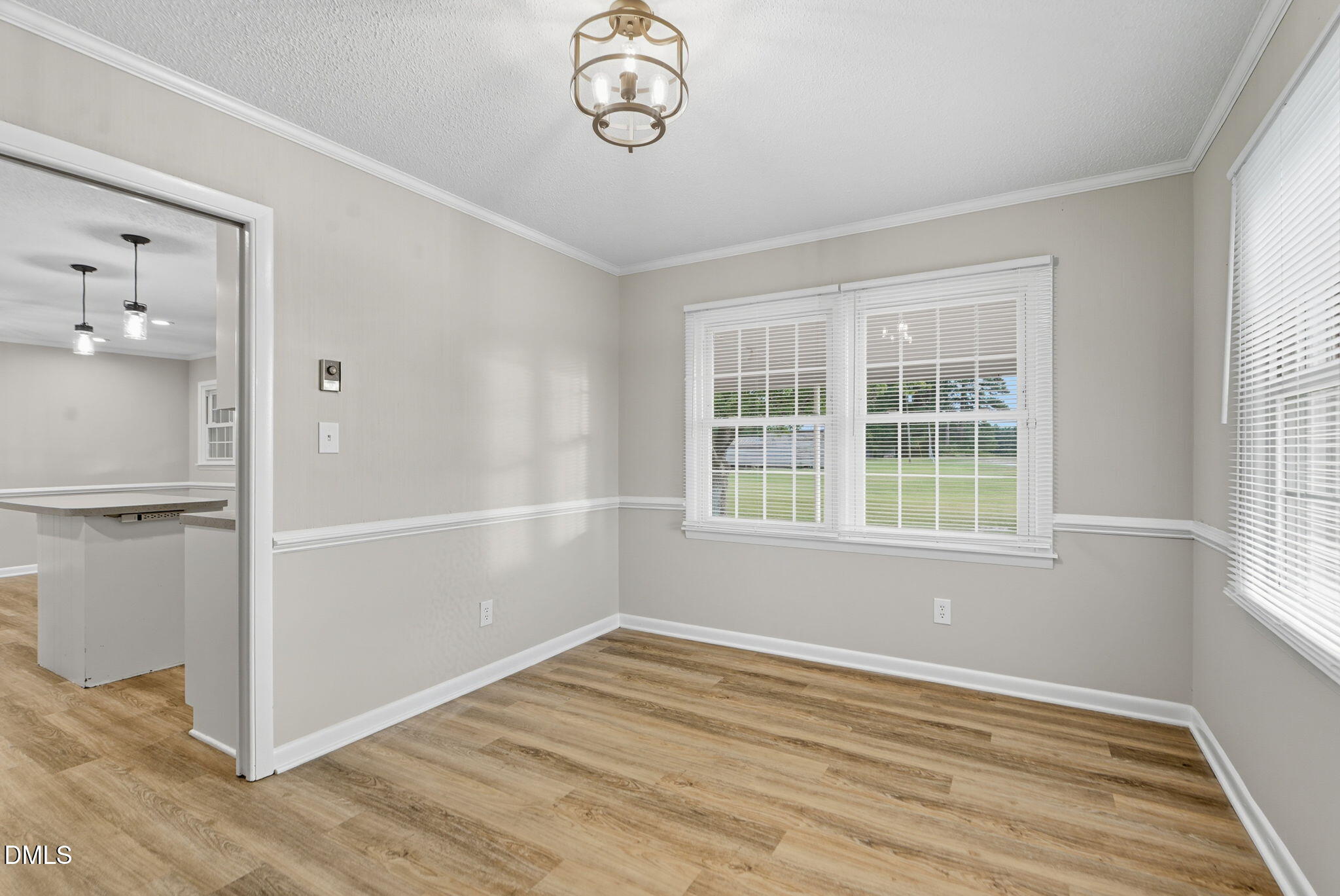 2238 Tarboro Road Youngsville, NC 27596 - Photo 21 of 41 an empty room with wooden floor and windows