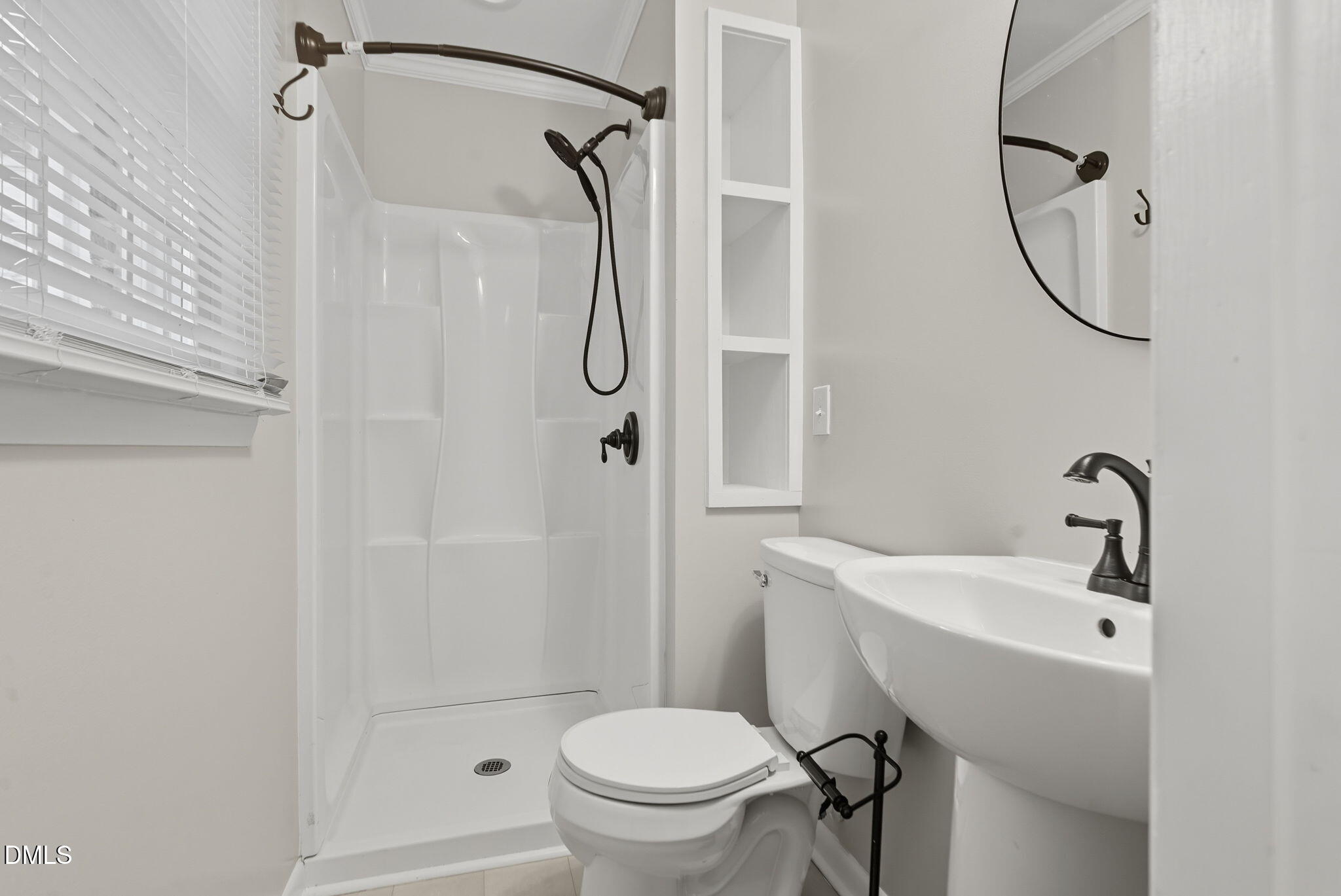 2238 Tarboro Road Youngsville, NC 27596 - Photo 28 of 41 a bathroom with a sink a toilet and shower