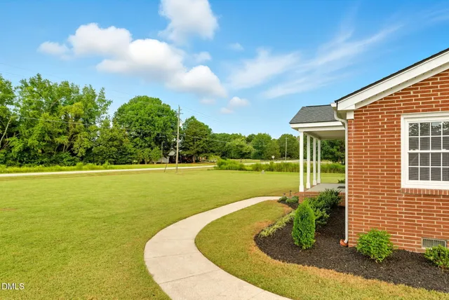 a view of a lake with a house in the background