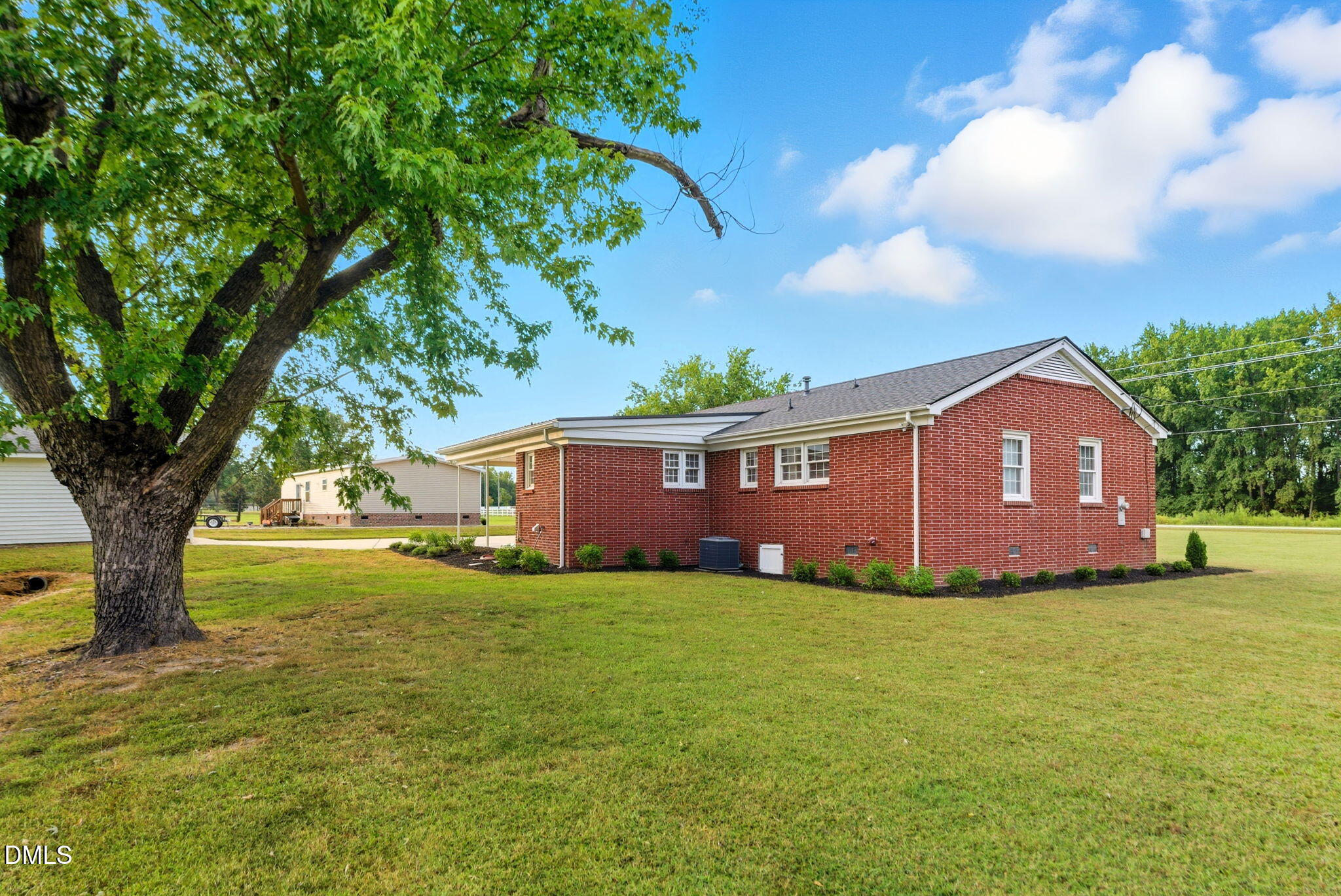 2238 Tarboro Road Youngsville, NC 27596 - Photo 41 of 41 a view of a house with a yard