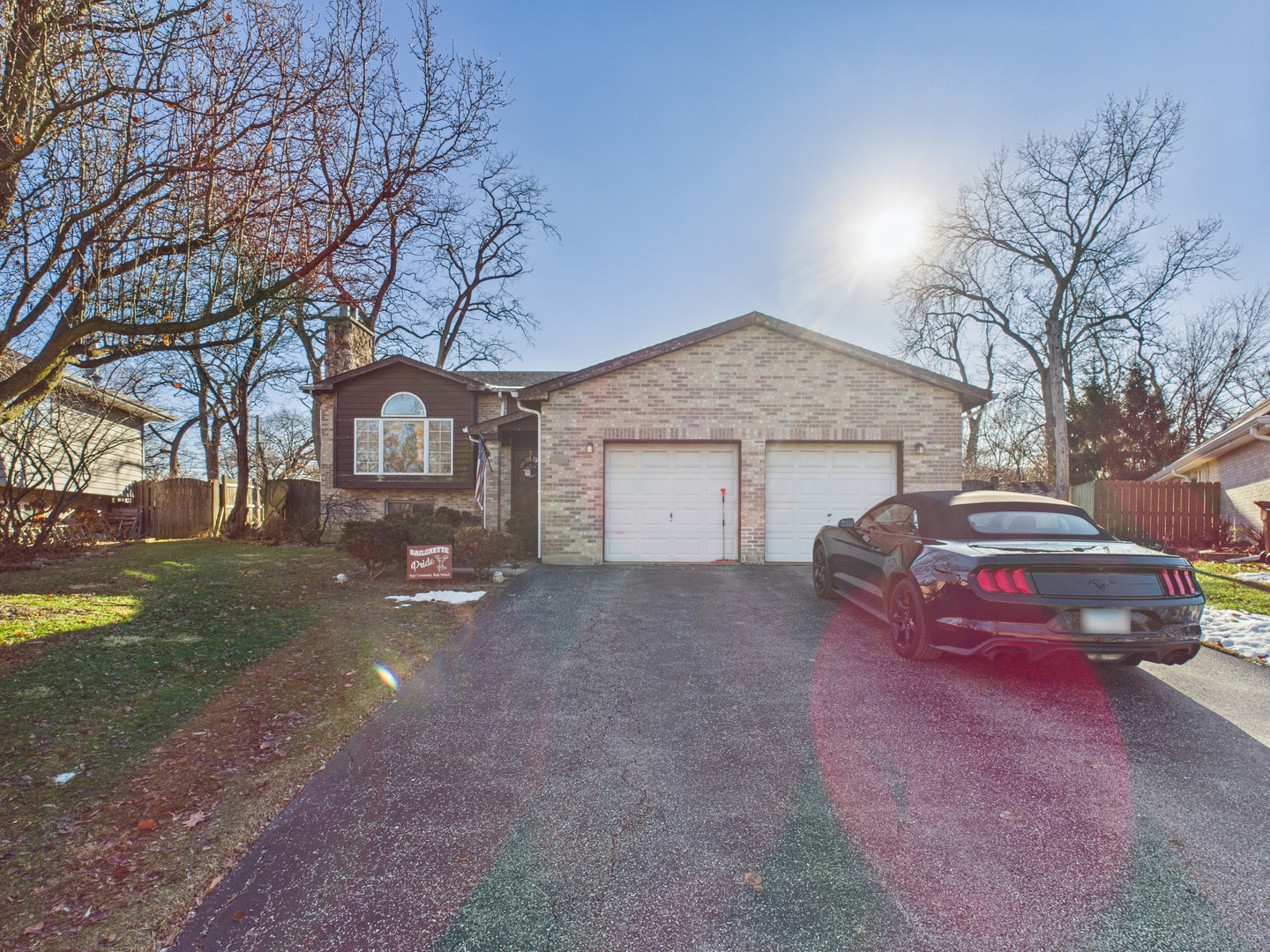 1380 Oak Ridge Court Willow Springs, IL 60480 - Photo 2 of 7 a front view of a house with a yard and garage