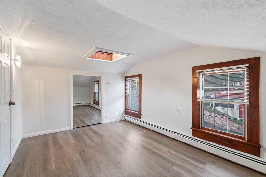 21 Maple Street Lyons, NY 14489 - Photo 19 of 37 The primary bedroom - walk in closet and skylight!