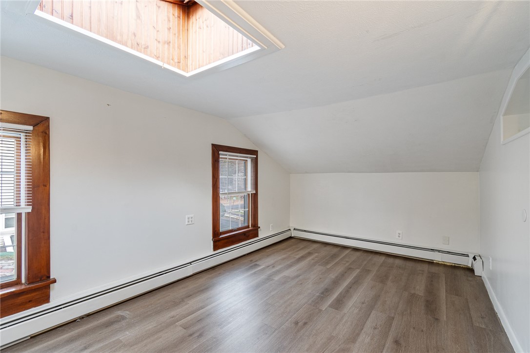 21 Maple Street Lyons, NY 14489 - Photo 20 of 37 The primary bedroom with walk in closet and skylig