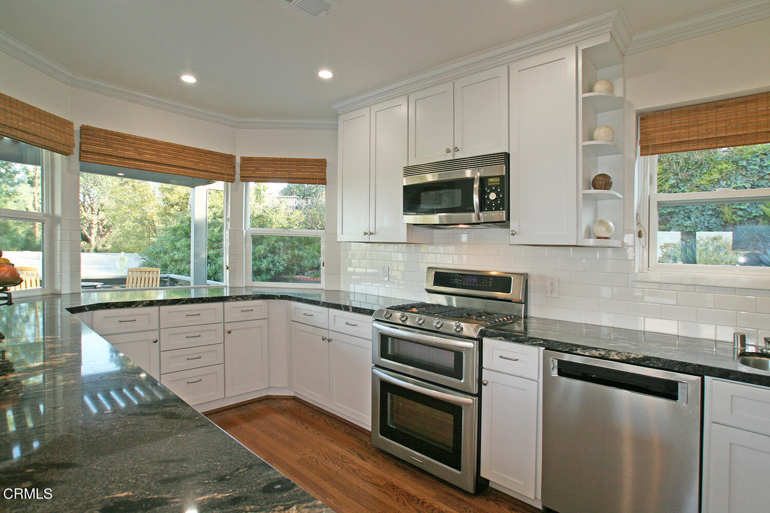 1600 Pleasant Way Pasadena, CA 91105 - Photo 18 of 51 a kitchen with granite countertop a stove a sink and a microwave