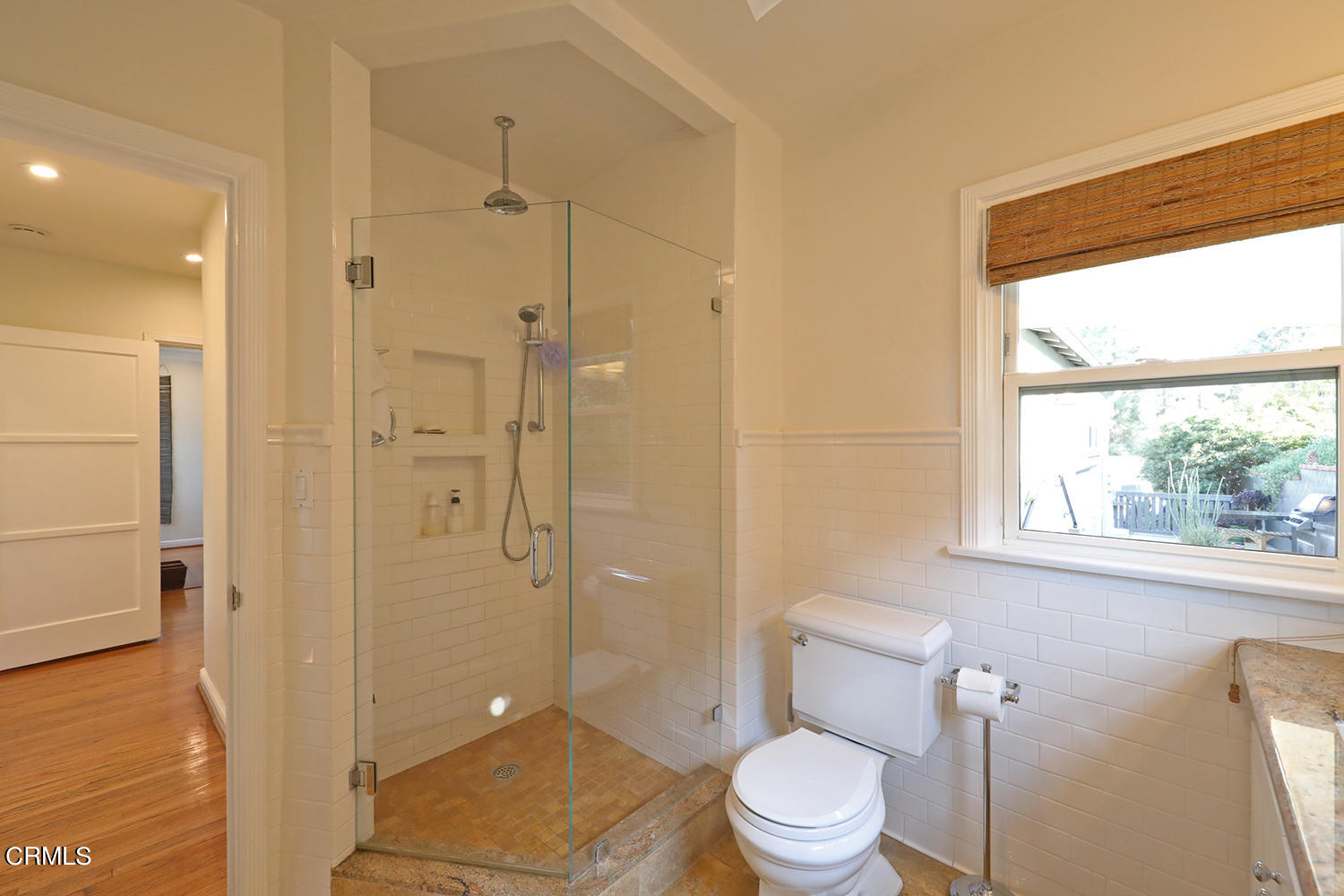 1600 Pleasant Way Pasadena, CA 91105 - Photo 30 of 51 a bathroom with a granite countertop toilet a sink a shower and a window