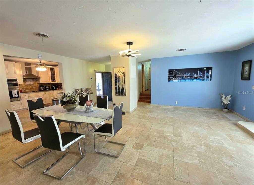 6736 Ralston Beach Circle Tampa, FL 33614 - Photo 16 of 37 a view of a livingroom with furniture and a flat screen tv