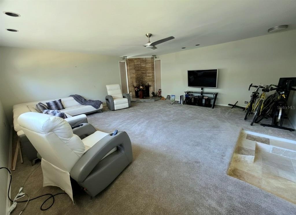 6736 Ralston Beach Circle Tampa, FL 33614 - Photo 20 of 37 a living room with furniture and a flat screen tv