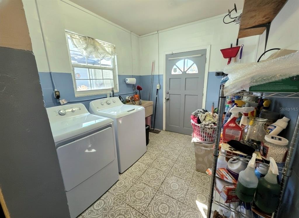6736 Ralston Beach Circle Tampa, FL 33614 - Photo 23 of 37 a utility room with dryer washer and a window