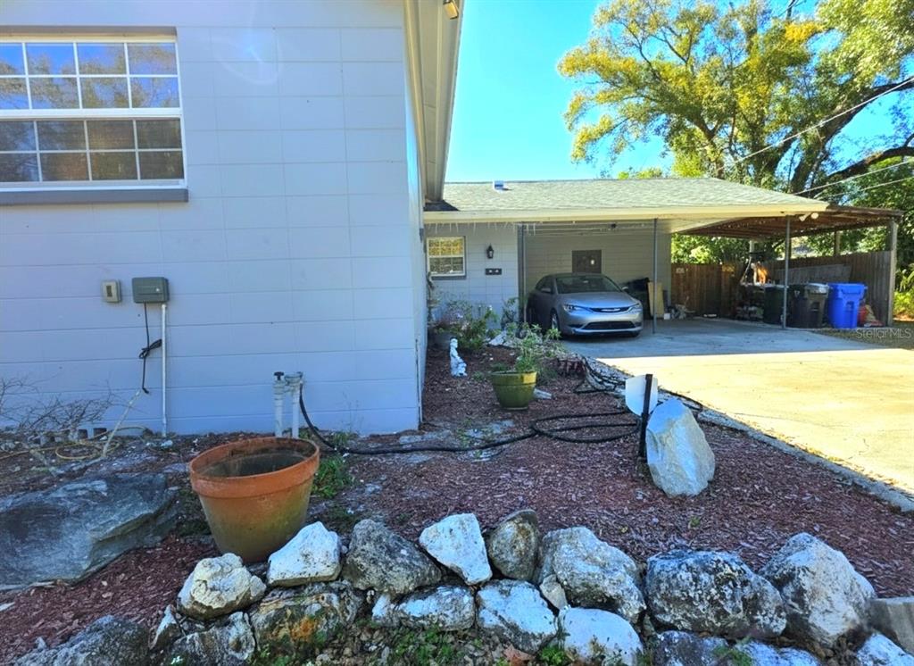 6736 Ralston Beach Circle Tampa, FL 33614 - Photo 3 of 37 a view of a backyard with plants and patio