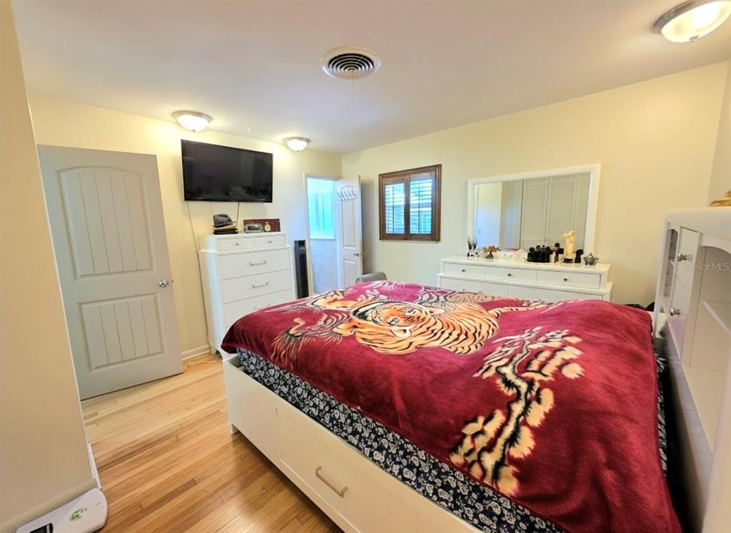 6736 Ralston Beach Circle Tampa, FL 33614 - Photo 31 of 37 a bed sitting in a bedroom and flat screen tv