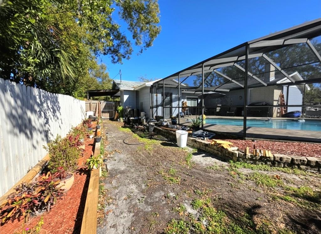 6736 Ralston Beach Circle Tampa, FL 33614 - Photo 33 of 37 a view of a house with a yard