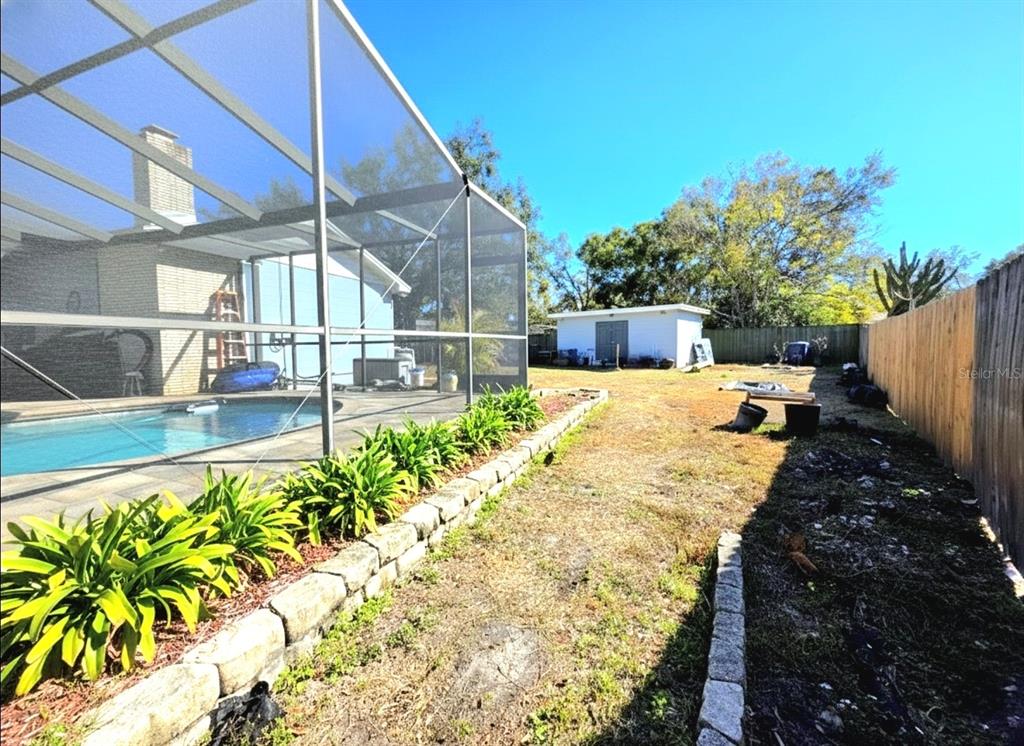 6736 Ralston Beach Circle Tampa, FL 33614 - Photo 34 of 37 a view of a backyard with plants and patio