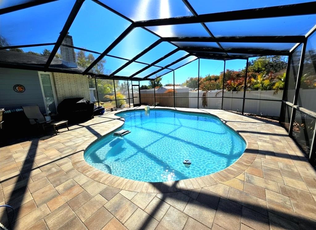 6736 Ralston Beach Circle Tampa, FL 33614 - Photo 8 of 37 a view of a swimming pool with a patio