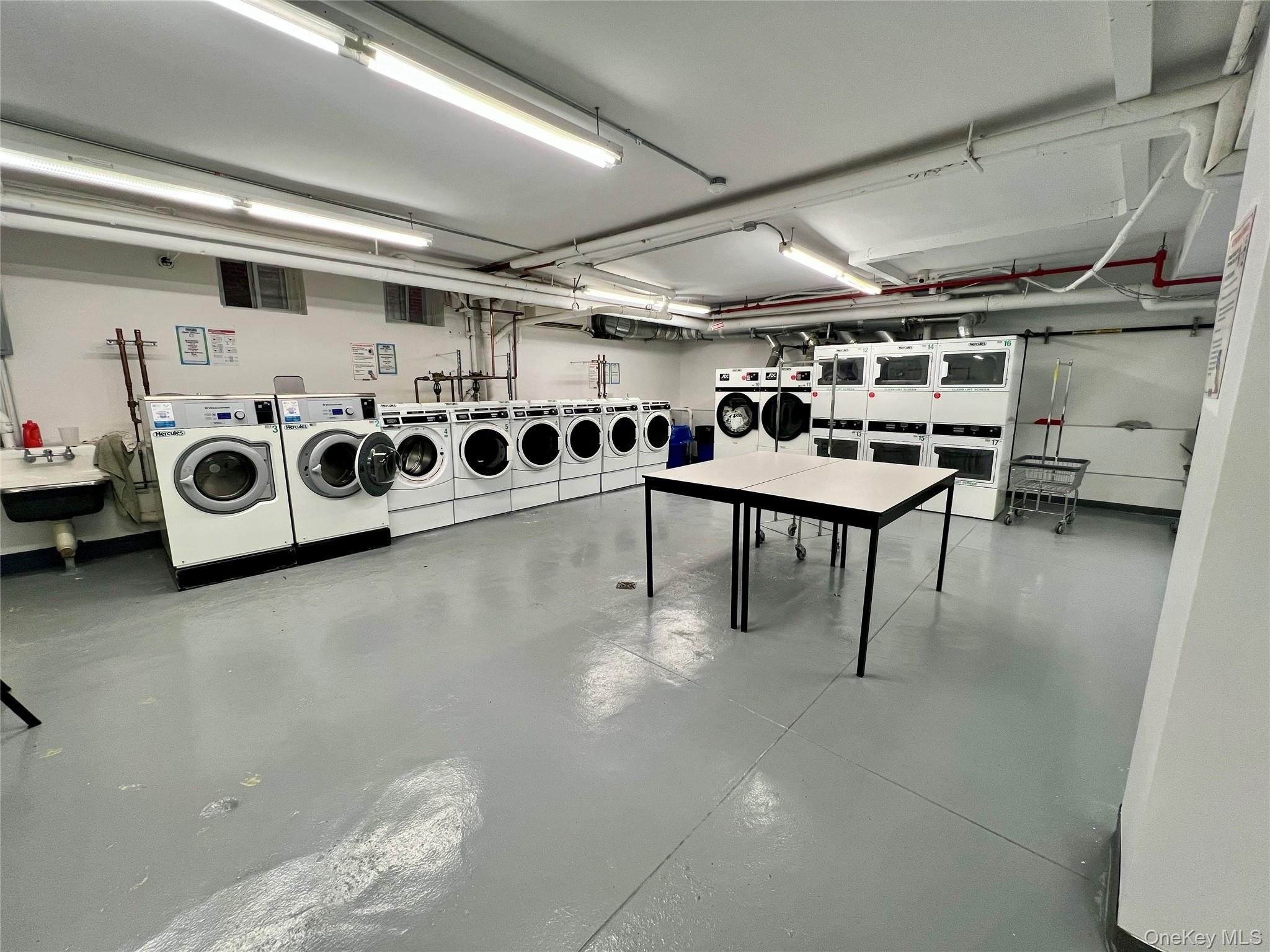 42-22 Ketcham Street, Unit F16 Queens, NY 11373 - Photo 15 of 17 a utility room with multiple furniture and windows