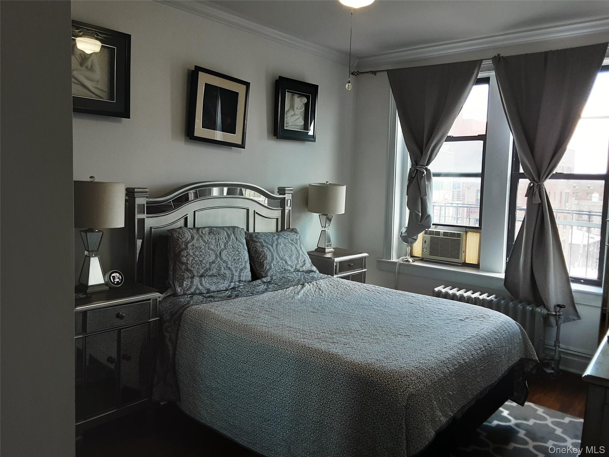 42-22 Ketcham Street, Unit F16 Queens, NY 11373 - Photo 3 of 17 a bedroom with a bed and a window