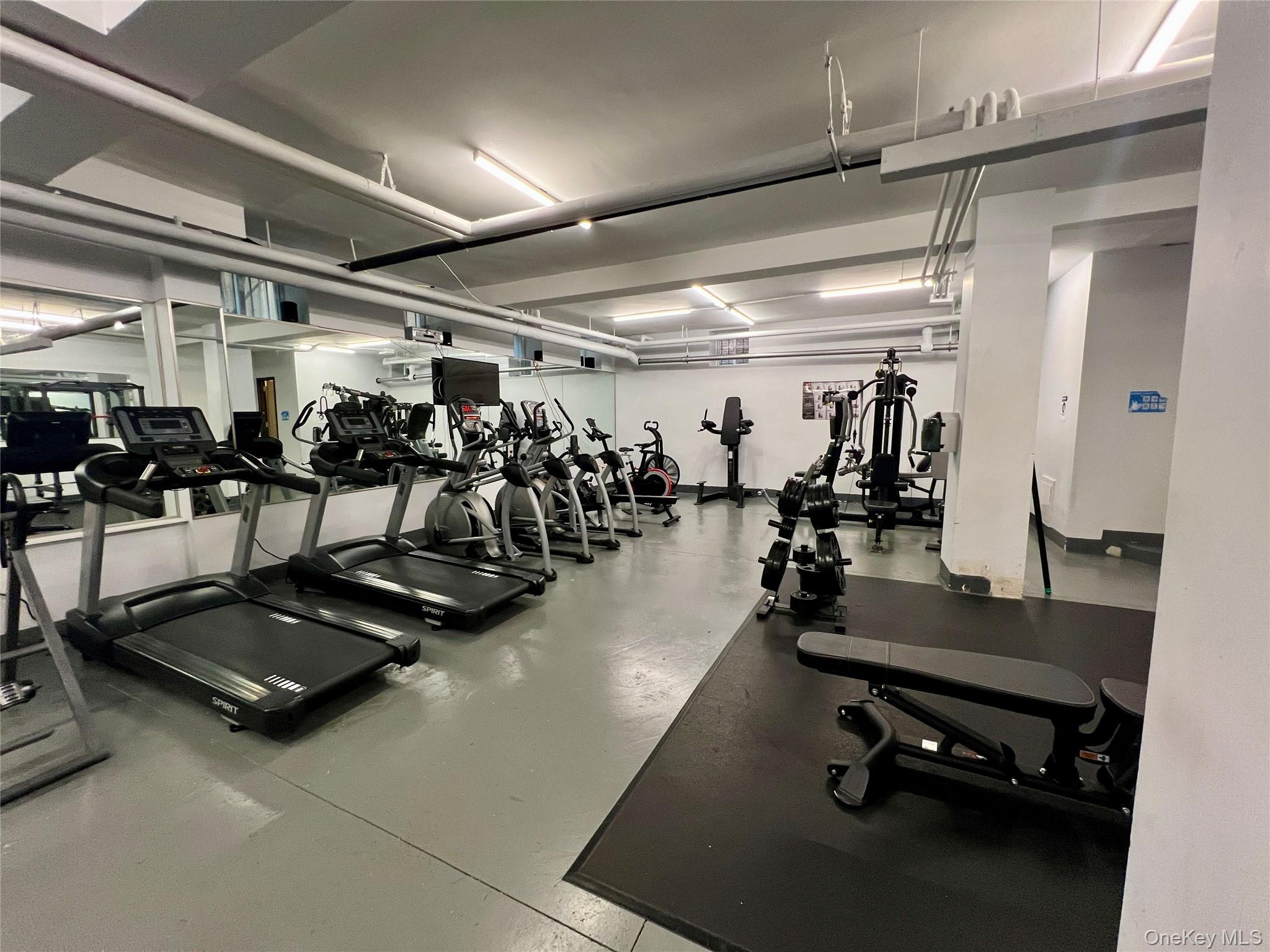 42-22 Ketcham Street, Unit F16 Queens, NY 11373 - Photo 5 of 17 a view of a room with gym equipment