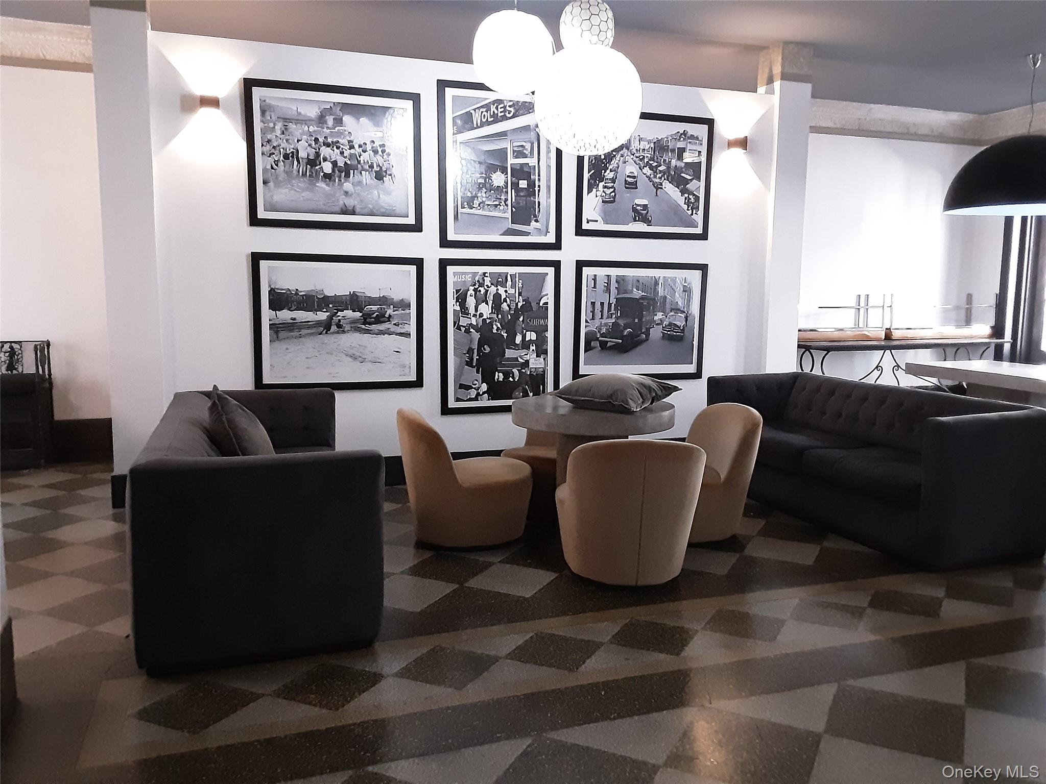 42-22 Ketcham Street, Unit F16 Queens, NY 11373 - Photo 6 of 17 a living room with furniture a large window with wooden floor