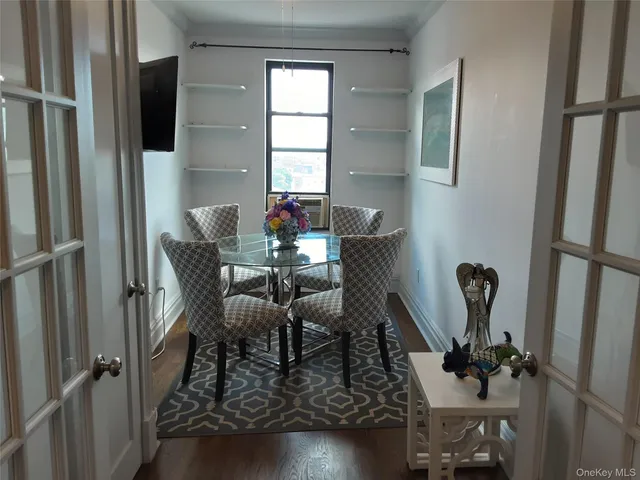 a living room with dining table and a couch