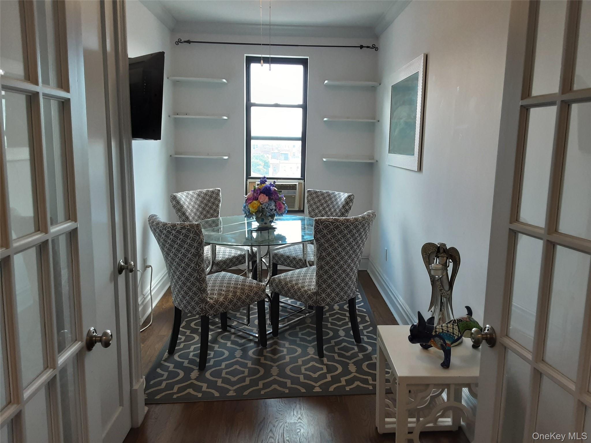 42-22 Ketcham Street, Unit F16 Queens, NY 11373 - Photo 9 of 17 a view of a room with furniture and wooden floor