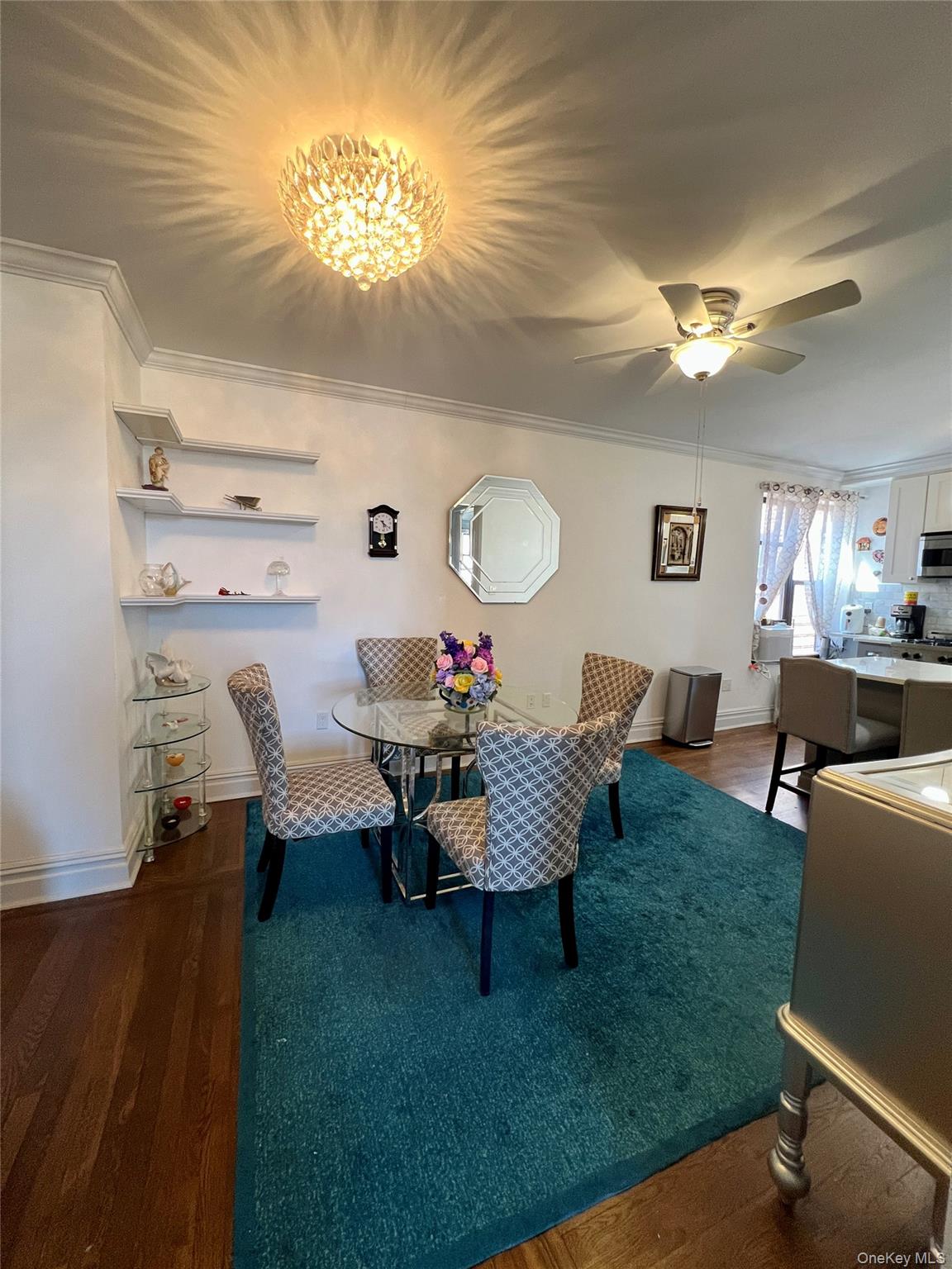 42-22 Ketcham Street, Unit F16 Queens, NY 11373 - Photo 10 of 17 a living room with dining table and a couch