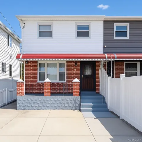 a front view of a house with balcony