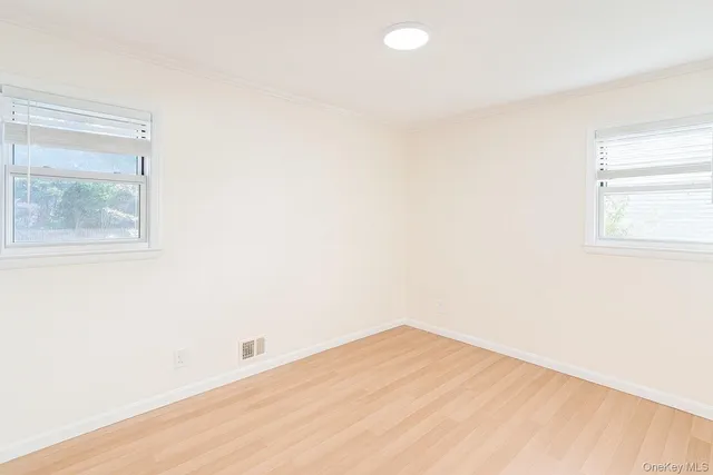 a white toilet sitting next to a white sink