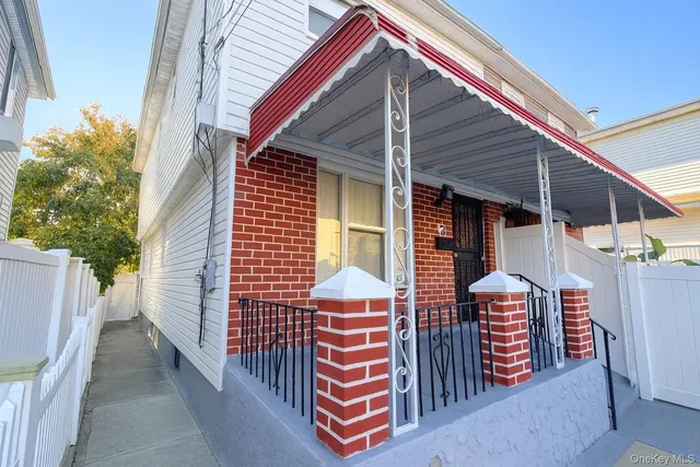 a front view of a house with a porch