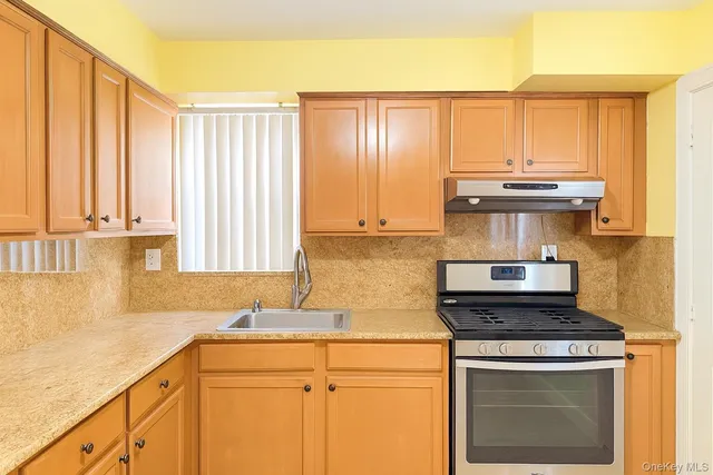 a view of a kitchen with a refrigerator