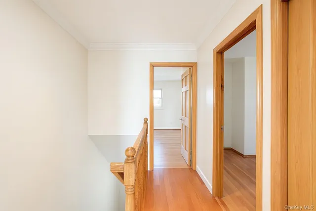 an empty room with a window and a ceiling fan