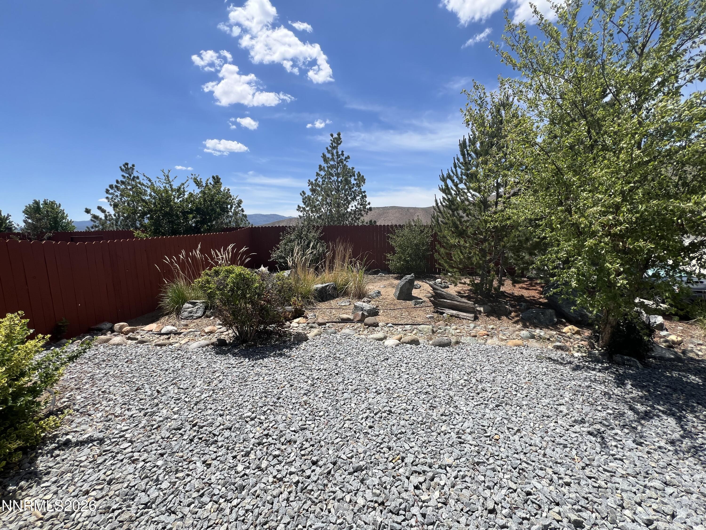 18406 Teddy Bear Court Reno, NV 89508 - Photo 42 of 44 a view of a backyard with sitting area