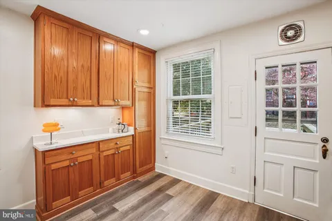 a view of a kitchen from the hallway