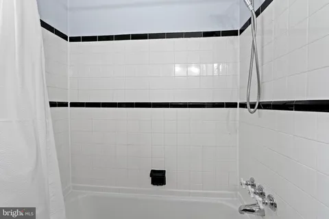 a view of a kitchen with closet and windows