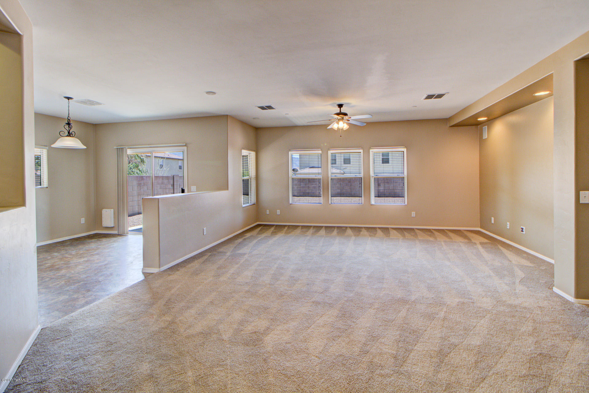 3588 East Mecate Road Tucson, AZ 85739 - Photo 6 of 36 a view of an empty room with a window