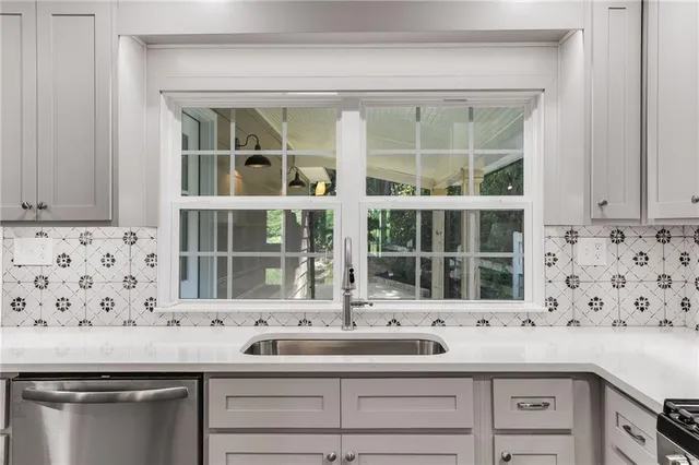 a kitchen with a sink and cabinets