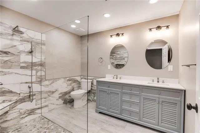a bathroom with a double vanity sink mirror and double