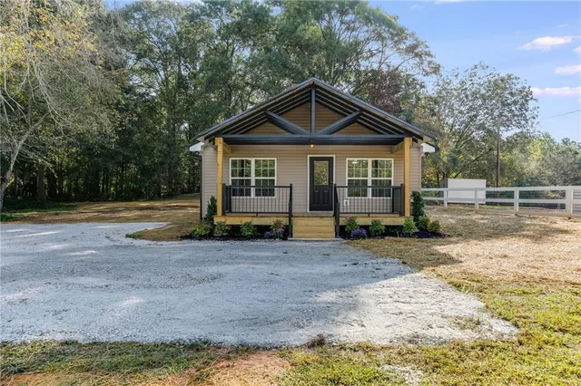 a front view of a house with yard