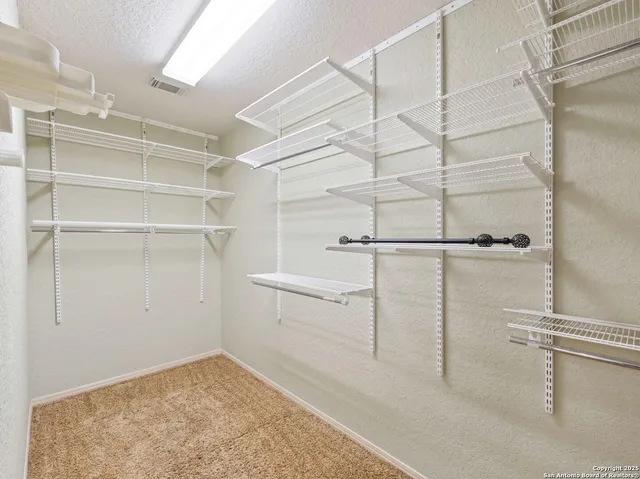 a view of a room with racks on the wall