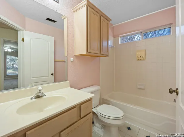 a bathroom with a sink a toilet and a bathtub