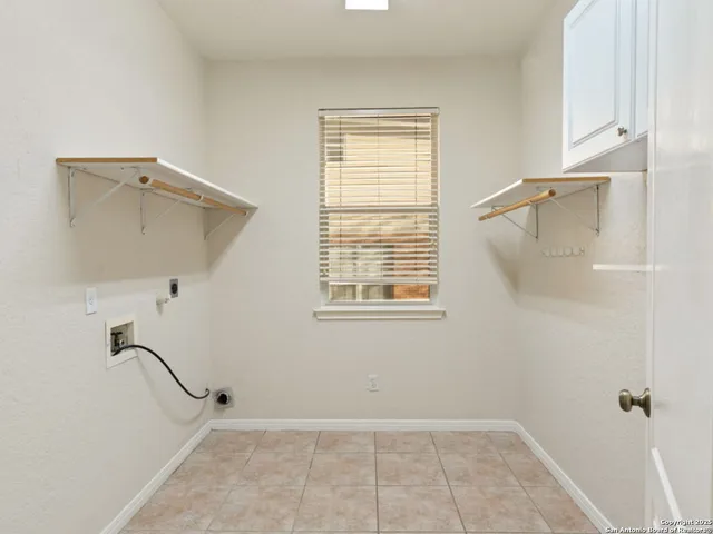 walk in closet with a window