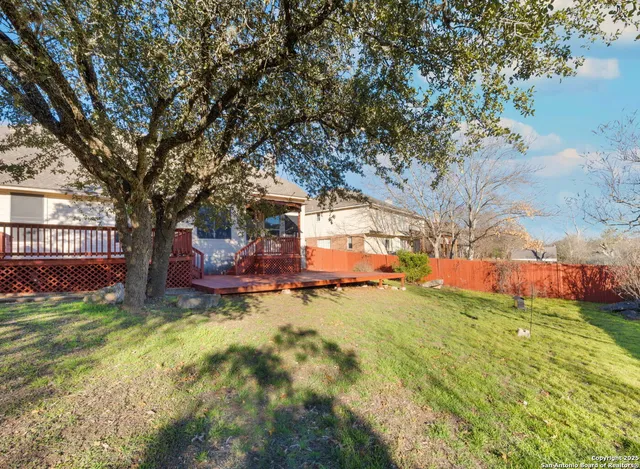 a view of a house with swimming pool and sitting area