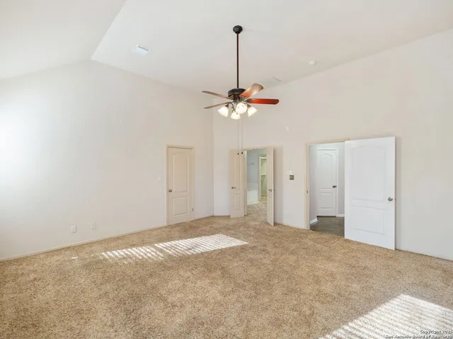 a view of a livingroom with a chandelier fan
