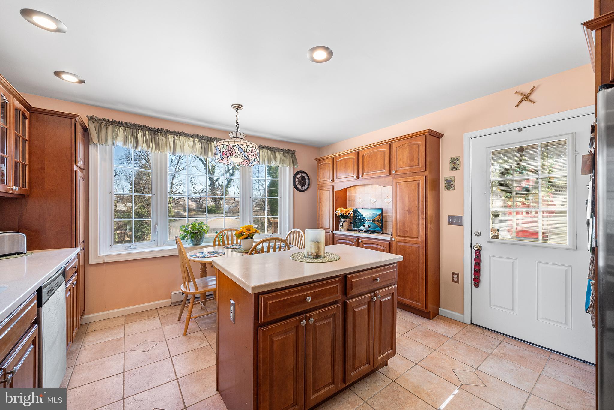 310 Manor Circle Folsom, PA 19033 - Photo 12 of 31 a kitchen with a sink stove and cabinets