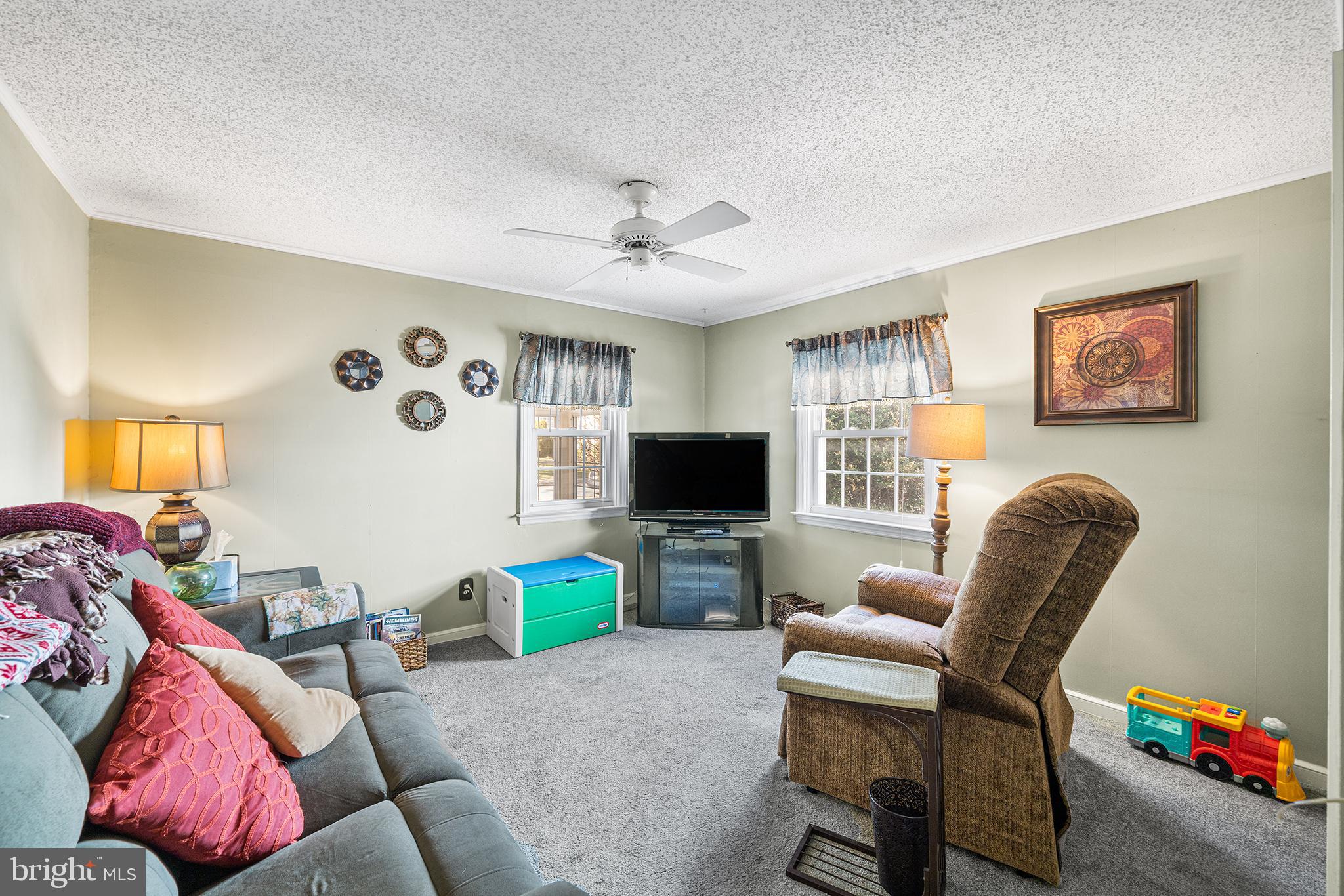 310 Manor Circle Folsom, PA 19033 - Photo 14 of 31 a living room with furniture and a flat screen tv