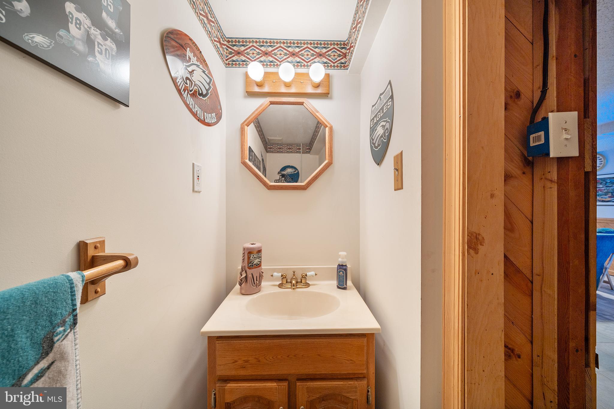 310 Manor Circle Folsom, PA 19033 - Photo 26 of 31 a bathroom with a sink and mirror