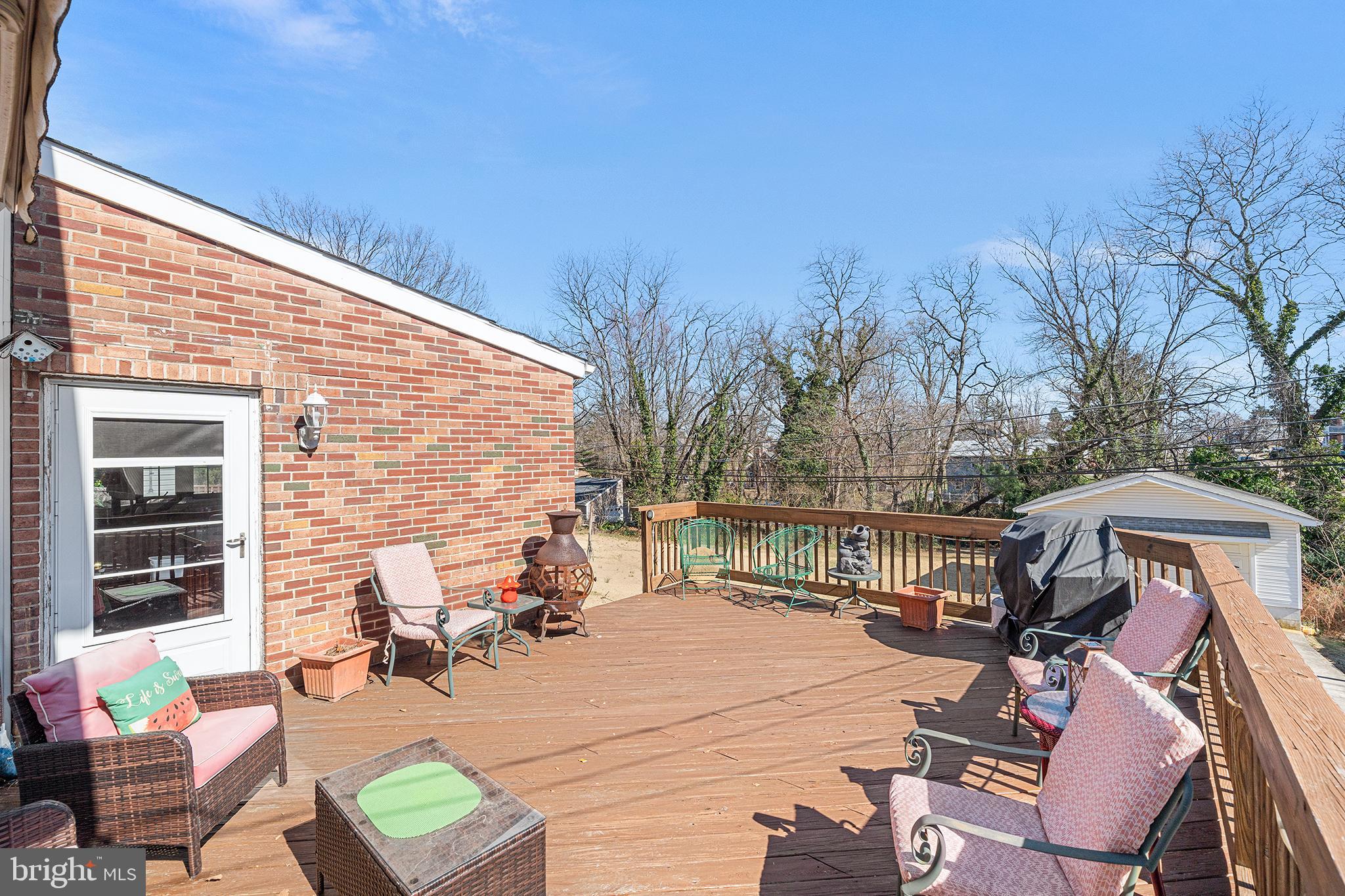 310 Manor Circle Folsom, PA 19033 - Photo 29 of 31 a view of a patio with couches table and chairs and potted plants