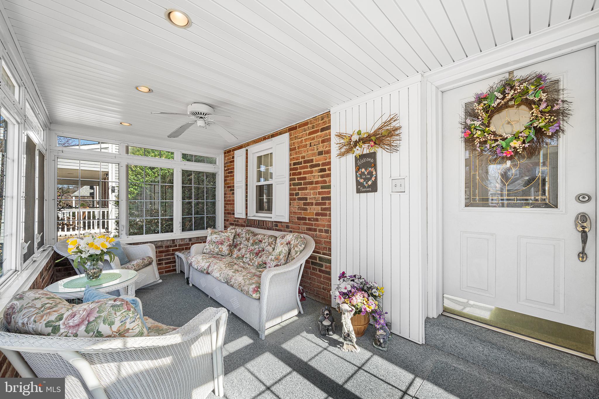 310 Manor Circle Folsom, PA 19033 - Photo 3 of 31 a living room with furniture and floor to ceiling windows