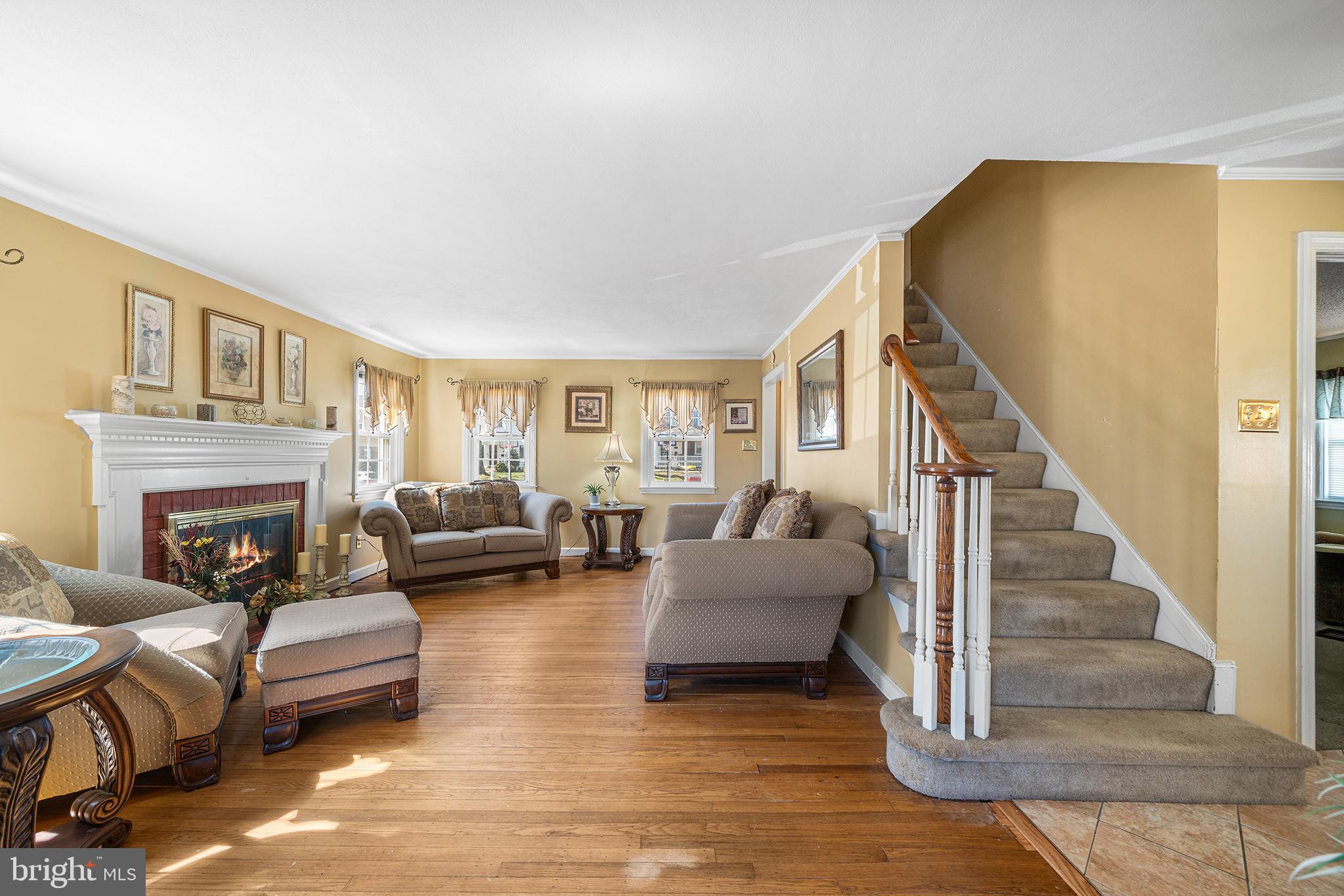 310 Manor Circle Folsom, PA 19033 - Photo 5 of 31 a living room with furniture and a fireplace