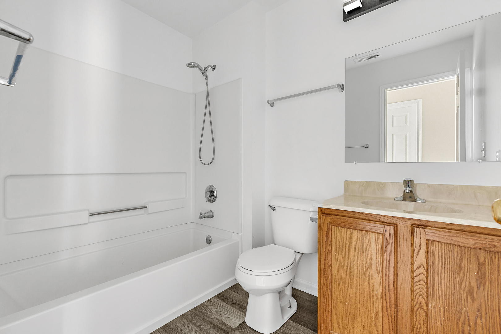 2123 Grayhawk Drive Aurora, IL 60503 - Photo 13 of 18 a bathroom with a granite countertop bathtub sink vanity mirror and toilet