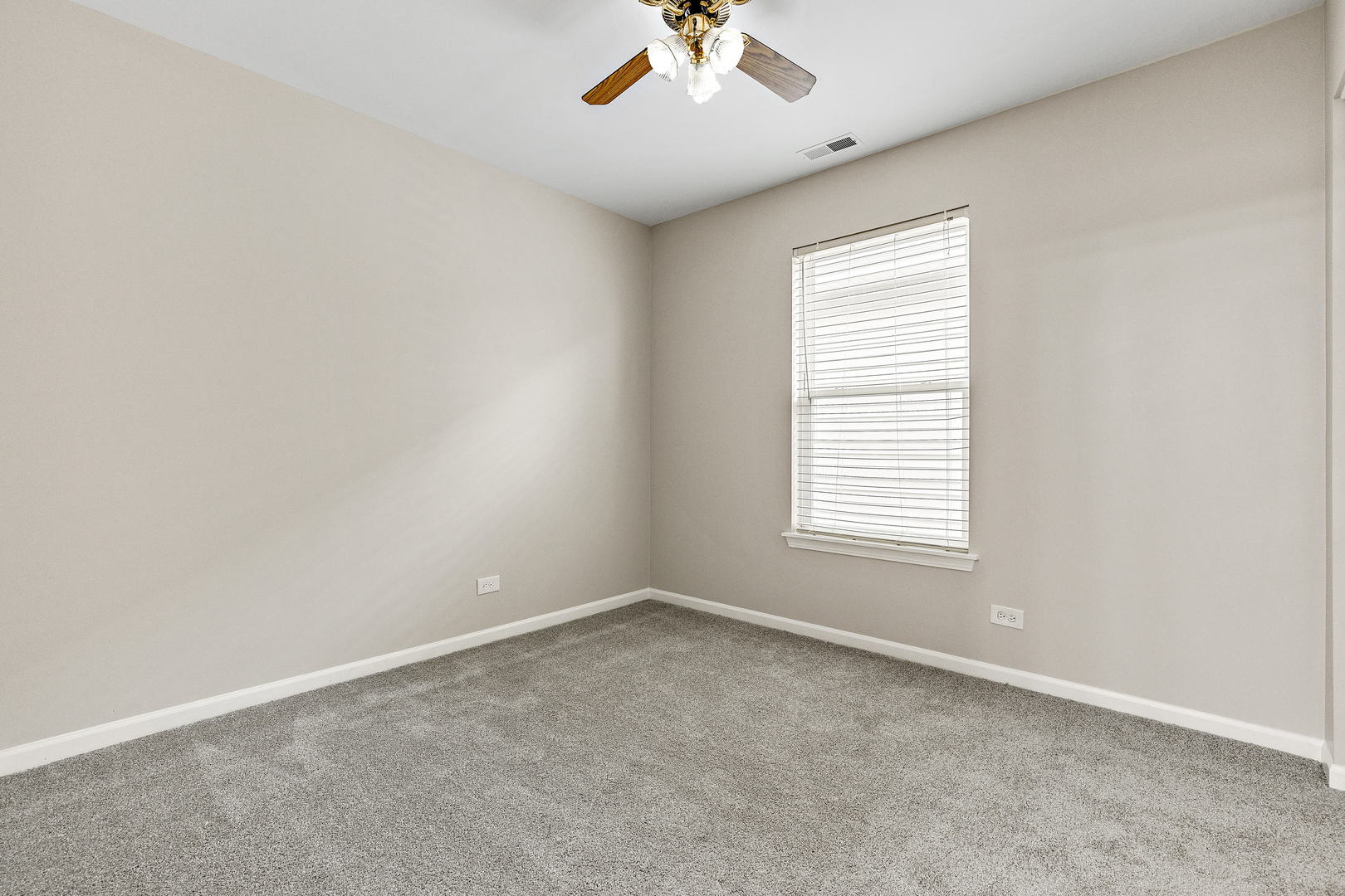 2123 Grayhawk Drive Aurora, IL 60503 - Photo 14 of 18 an empty room with a window